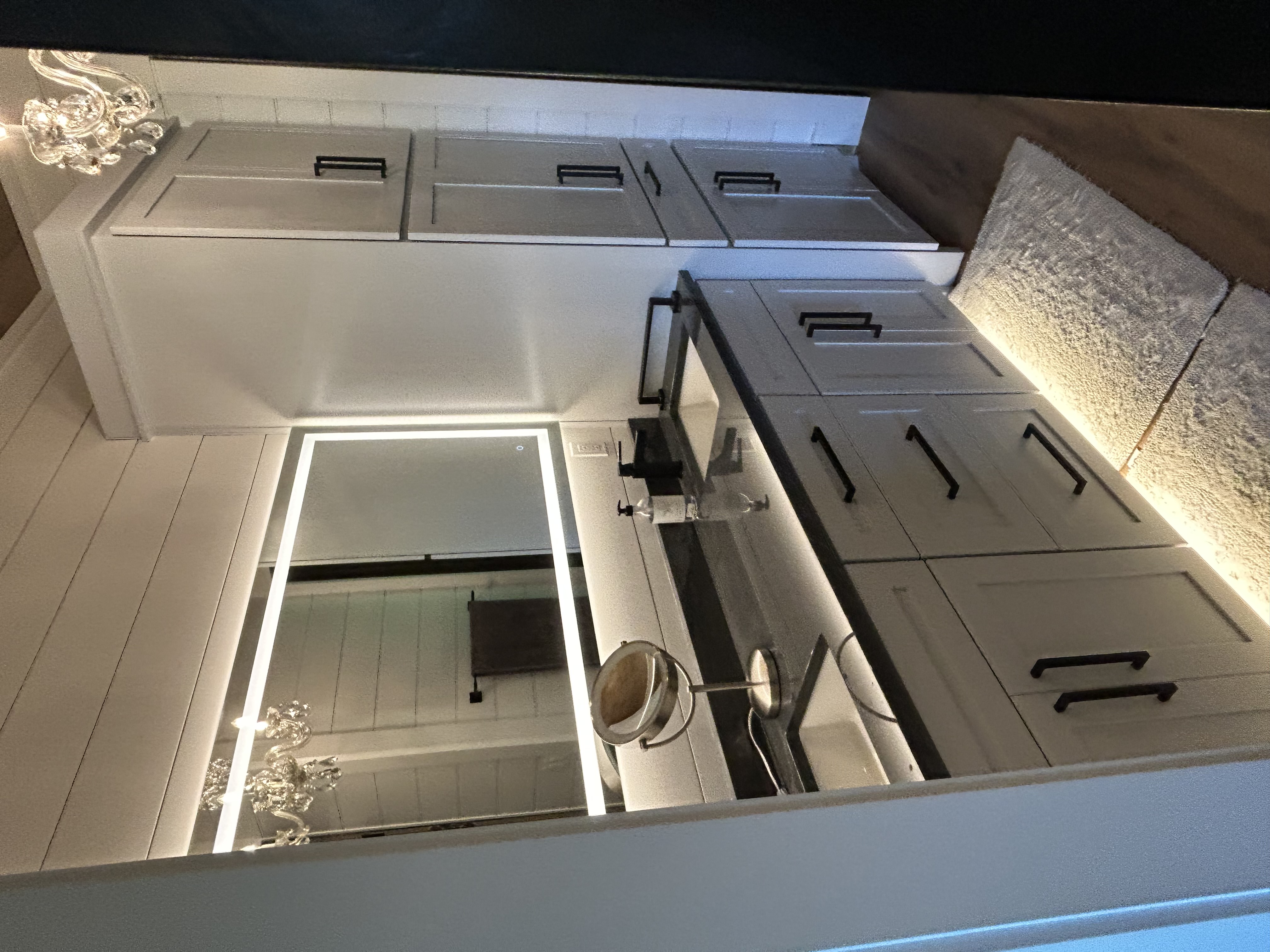 Custom bathroom vanity with LED mirror lighting — Up North Hand Crafted Cabinetry